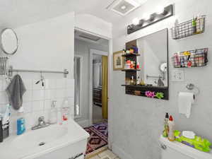 Bathroom with vanity and toilet