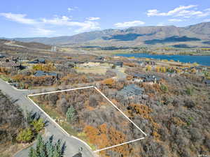 Aerial view featuring a water and mountain view