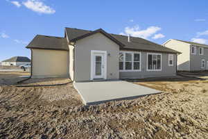 Rear view of property with a patio