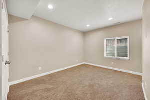 Unfurnished room featuring carpet