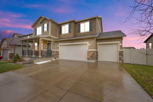 View of front of house with a garage and covered porch