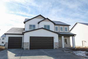 View of front of property with a garage