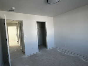 Unfurnished bedroom with a closet