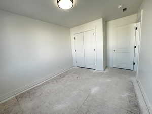 Unfurnished bedroom featuring a closet