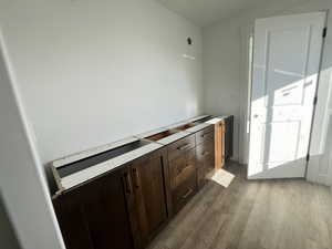 Bathroom with hardwood / wood-style flooring