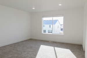 Empty room featuring carpet floors