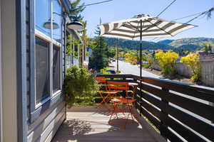 Wooden deck featuring a mountain view