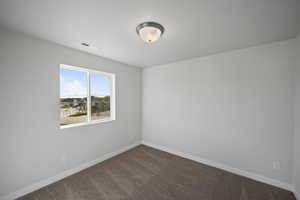 Unfurnished room featuring carpet flooring