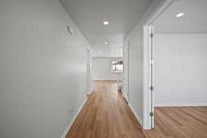 Corridor featuring light hardwood / wood-style floors