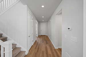 Hallway featuring wood-type flooring