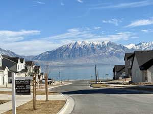 View of road featuring a water and mountain view