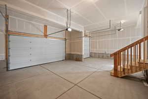 Garage featuring a garage door opener