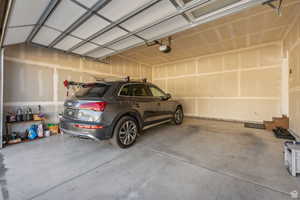 Garage featuring a garage door opener