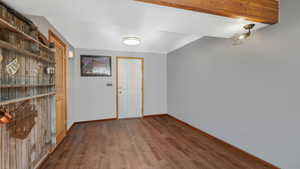 Foyer with dark hardwood / wood-style floors