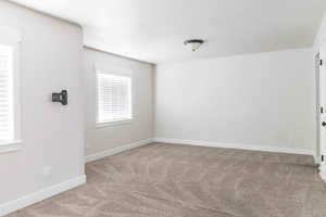 Empty room with carpet flooring