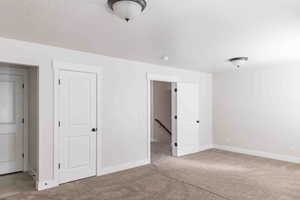 Unfurnished bedroom with carpet