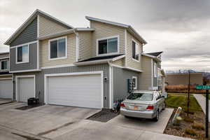 View of back of property featuring a garage