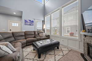 Carpeted living room and plenty of natural light