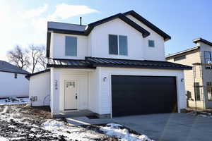 View of front of property featuring a garage