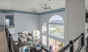 Interior space featuring hardwood / wood-style flooring and ceiling fan