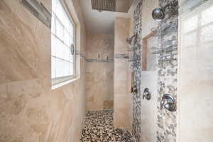 Bathroom with a tile shower