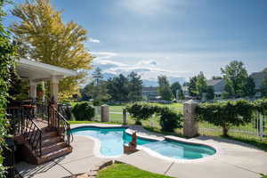 View of pool featuring an in ground hot tub