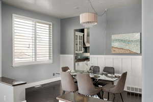 Dining room with dark wood-type flooring