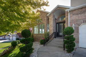 Entrance to property featuring a garage