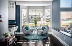 Sitting room with dark hardwood / wood-style floors