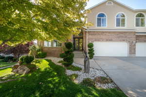 View of front of house with french doors and a garage