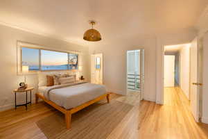 Bedroom featuring light hardwood / wood-style flooring and ornamental molding