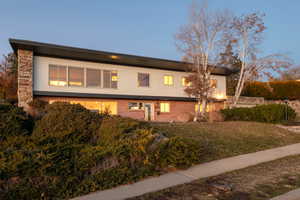 View of front of house with a yard