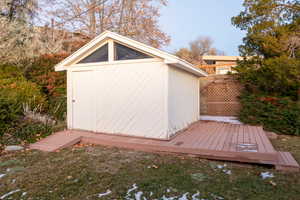 Exterior space featuring a storage unit