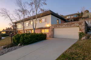 View of front facade featuring a garage