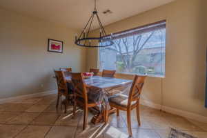 Semi-formal dining with big windows & cutstom light fixture