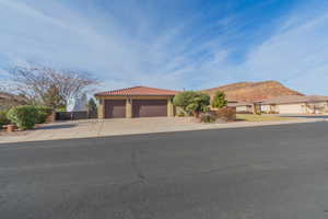 Garage view with lots of parking space & RV parking behind the fence