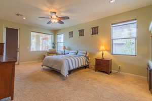 Primary bedroom with ceiling fan