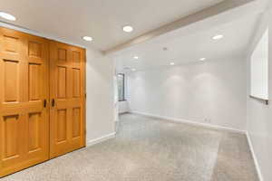 Empty room featuring carpet flooring