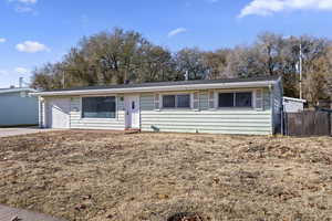 Ranch-style home featuring a garage