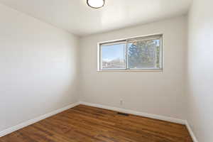 Unfurnished room featuring hardwood / wood-style floors