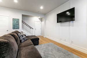 Living room with light wood-type flooring