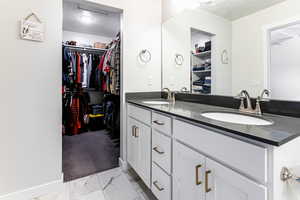 Bathroom with vanity and a textured ceiling