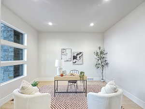 Home office featuring light hardwood / wood-style floors