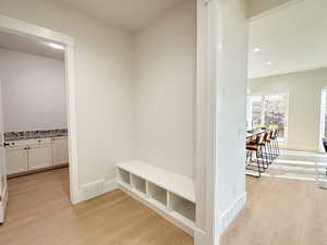 Mudroom with light wood-type flooring