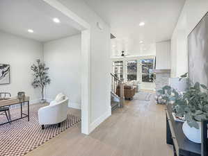 Hallway featuring light wood-type flooring