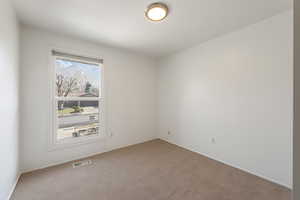 Unfurnished room featuring carpet floors