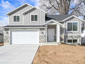 View of front of property featuring a garage