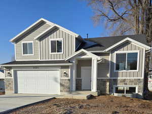 View of front facade featuring a garage