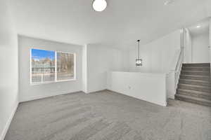 Unfurnished living room with carpet floors