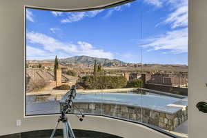 View of pool with a mountain view and a jacuzzi